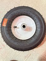 full view of wheel showing tire and rim