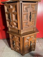 Both hexagon wooden end tables stacked to show overall shape and doors
