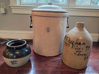 Front view of all three stoneware pieces showing size and decoration