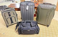 Front view of all four luggage pieces standing upright