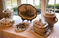 Group shot of all seven ceramic pieces arranged on table