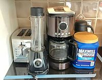 All four appliances with Maxwell House canister visible