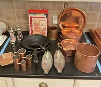 overview of all cookware, measuring cups, skillets, corn dishes, salt & pepper mills