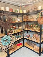 Full view of both shelving units displaying majority of decor items and baskets