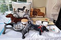 Overall lot showing pillows, figures, tray, mugs, dish, canister, and bowl stand