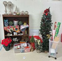 Overview tall tree, tabletop trees, storage totes, wrapping paper, ornaments, mercury glass décor