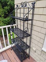 Full view of wrought iron baker's rack on deck