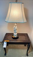 Lamp on side table showing overall lot