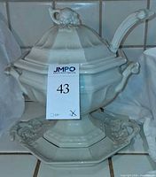 Full view of tureen, ladle, underplate