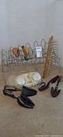 Group shot: foot massager, two wire shoe racks, tie rack, wooden shoe shapers, black and brown shoe trees