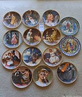 Group shot of all 15 decorative plates on carpet