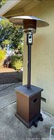 Full view of Bali propane heater showing reflector hood, pole, tabletop, wicker base