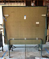 Rear view of folded Harvard ping pong table showing frame and legs