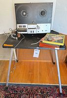 Full view of Sony recorder on DA-LITE stand with microphone and tape boxes