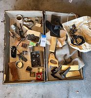 Open carrying case showing full assortment of tools and hardware