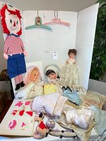 Overall lot with pajama bag, bride doll, baby clothes, shoes, plush toys, hangers