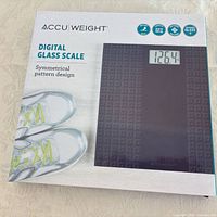 Retail box showing AccuWeight digital glass scale branding and image