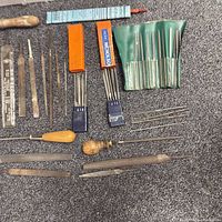 Overview of all files including boxed sets, green pouch, loose files with handles