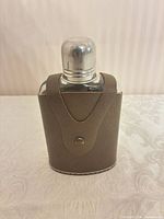 Flask inside leather case, front view