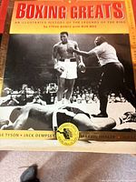 Front cover showing title, authors, cover photo of Muhammad Ali standing over opponent