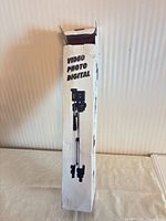 Tripod boxed view front, text VIDEO PHOTO DIGITAL