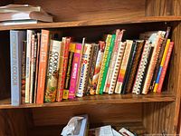 Full shelf showing majority of the cookbooks