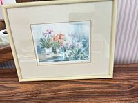 Front view of framed print showing artwork, mat, frame