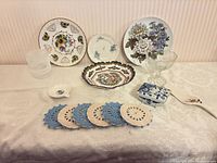 Full lot overview showing plates, bowl, compote, trinket box, server, spoon rest, coasters