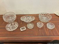 All eight glass pieces laid out on table