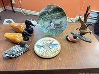 Overall lot showing all duck-themed pieces on table