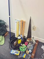 Group view of entire lot including saw, flashlight, trouble light, cords, tapes, Velcro, heat-shrink, glue, wooden blocks