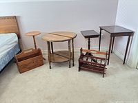 Group shot of seven visible wooden pieces against wall