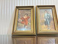 Both framed prints standing side by side showing overall appearance and frame style