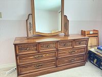 Full dresser with attached mirror, six drawers visible