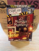 Front of one Murder Mystery expansion pack showing artwork and branding