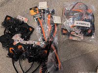 Headbands, packaged clip-in extensions and bag of hair ties