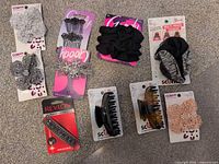 All nine carded hair accessories laid out on carpet