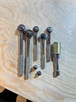 All eight pieces: five ratchets, spark plug socket, two adapters
