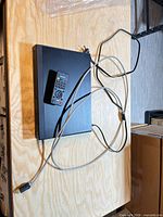 Top view of Sanyo Blu-ray player with remote and HDMI cable displayed