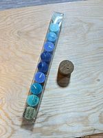 Sealed IKEA GENIAL pack of 10 coloured candles and separate gold pillar candle