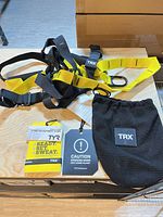 Overall view of TRX straps, booklets and bag