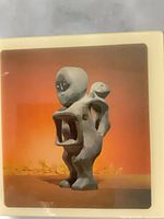 Front view of framed tile print showing sculpture image