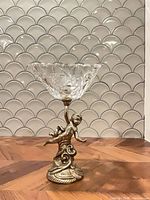 full view of crystal compote on cherub brass stand