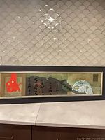 Front view of framed panoramic abstract painting