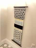 Full view of fabric wall hanging displayed on wall