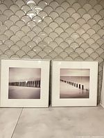 Both framed seascape prints side by side showing overall appearance