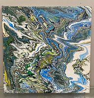 Front view of abstract acrylic pour painting showing colors and overall design
