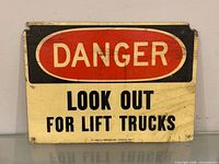 Front view of the sign showing full text and wear