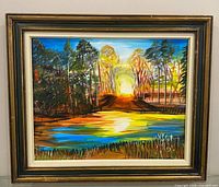 Full view of framed landscape painting