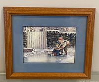 Front view of framed Trisha Romance print with wood frame and blue mat